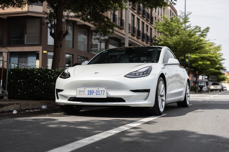 Voiture électrique en recharge sur borne dans un parking d’entreprise