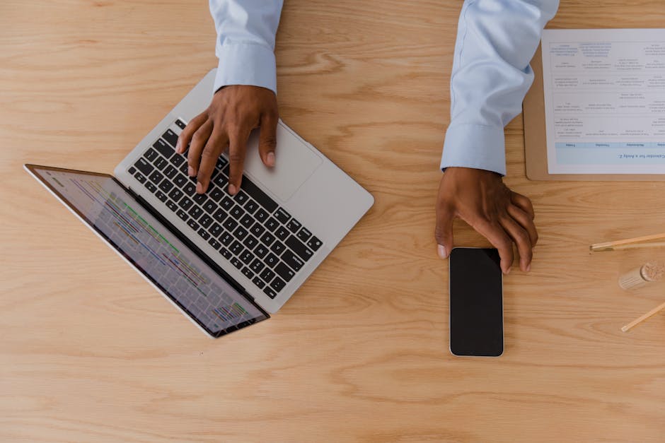 Recruiter reviewing a job application email on a laptop