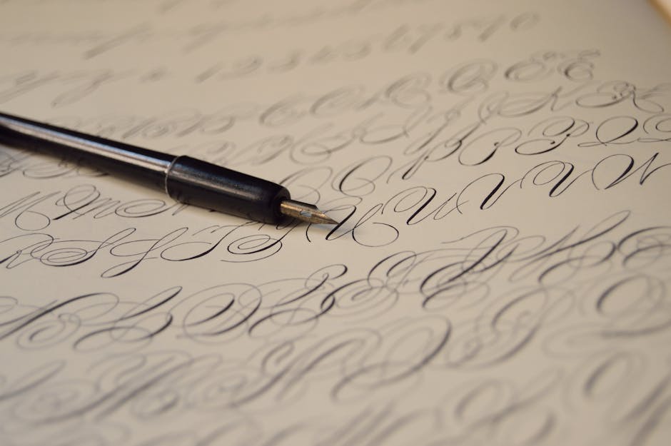 Person writing a business letter on a notebook