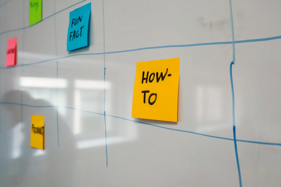 Team collaboration around a project board with sticky notes