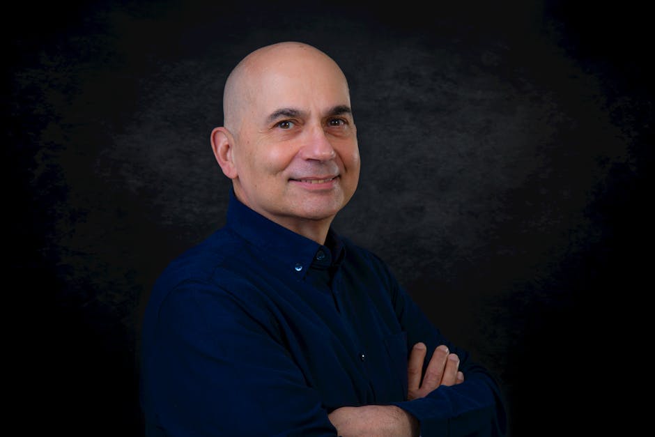 Professional headshot portrait with neutral background