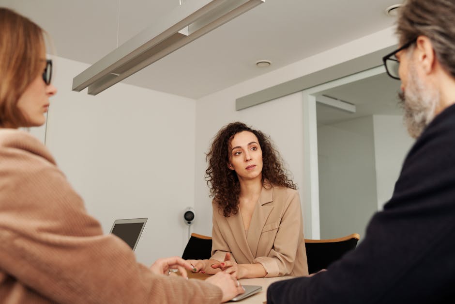 Two people in a professional office discussion during a formal meeting