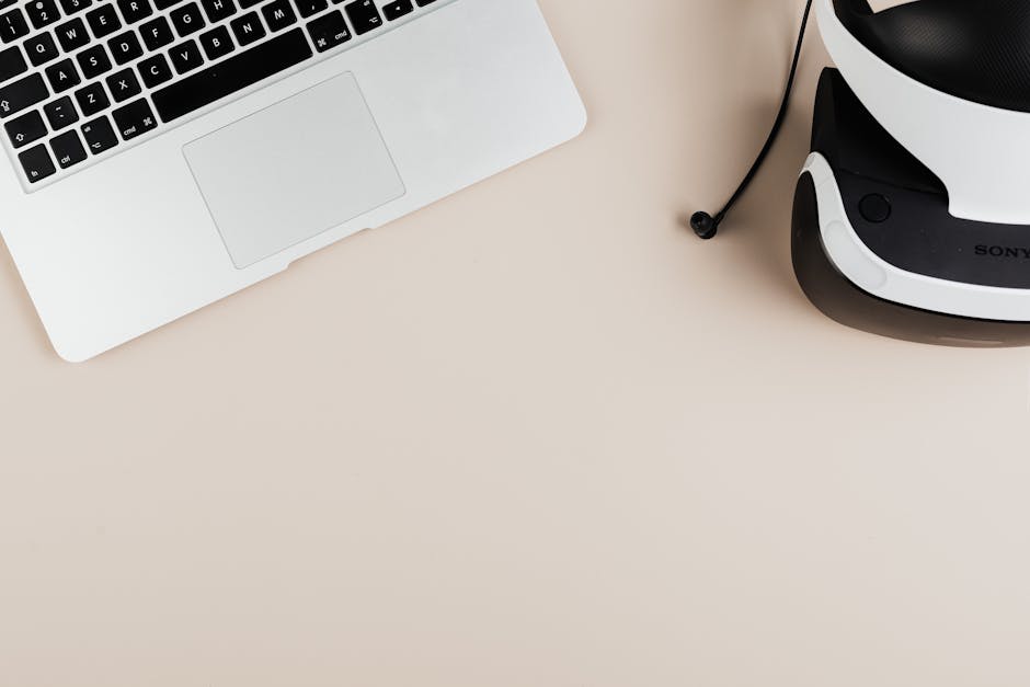 Video interview setup with laptop, headset and neutral background