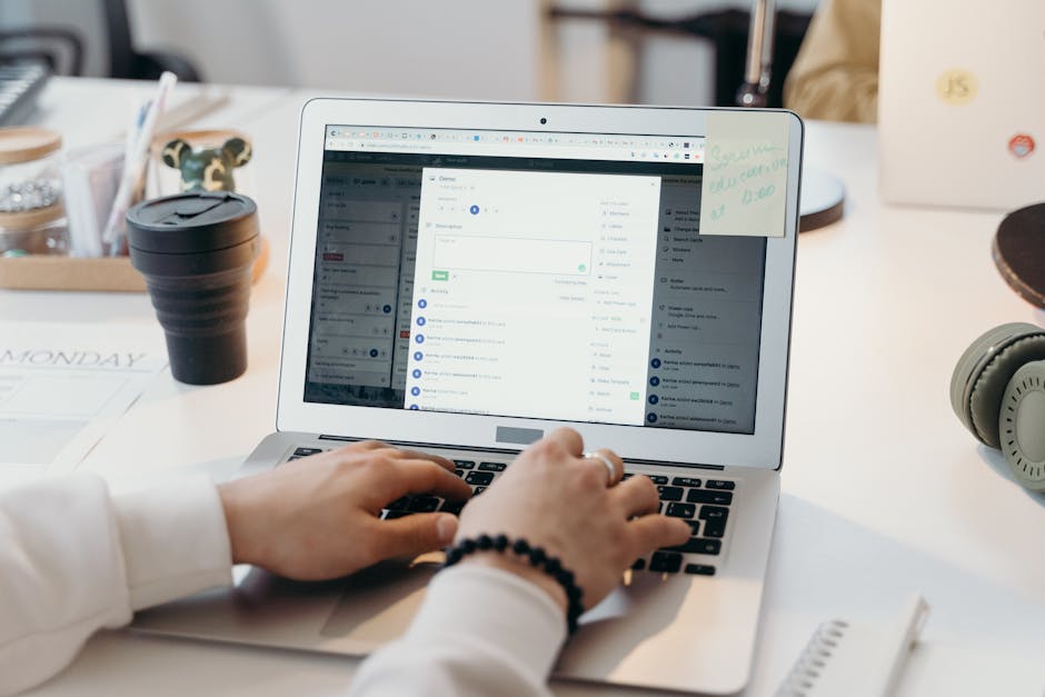 Person sending a spontaneous job application email from a modern workspace