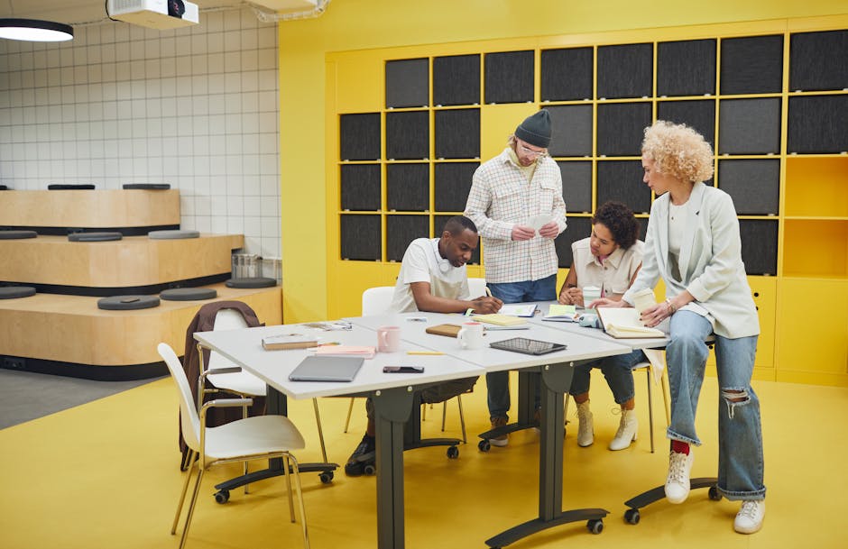 Team collaborating around a table in a modern workplace