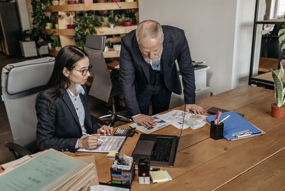 Manager and employee discussing leave request in office