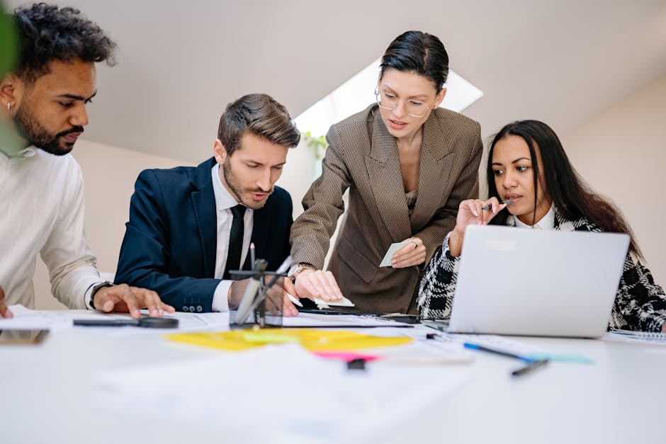 Business team discussing internal career mobility in a modern office