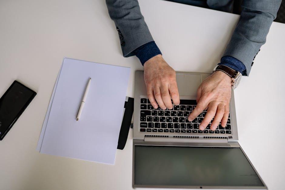 Professional employee writing a job application letter at a desk