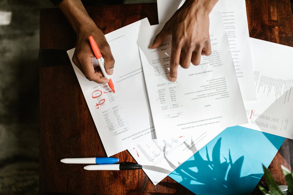 Person reviewing unemployment paperwork and documents