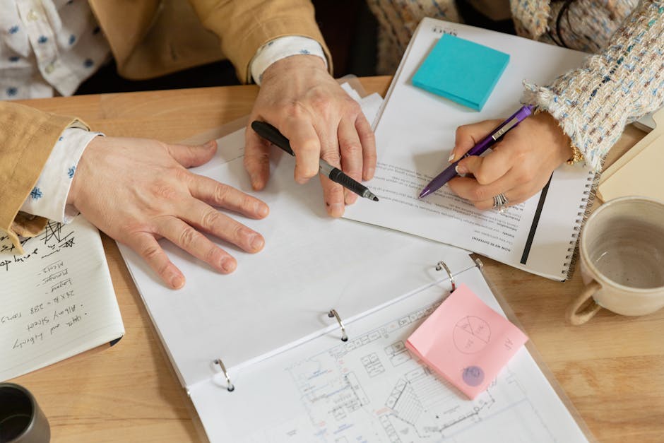 Professional planning meeting with agenda and notes on a desk