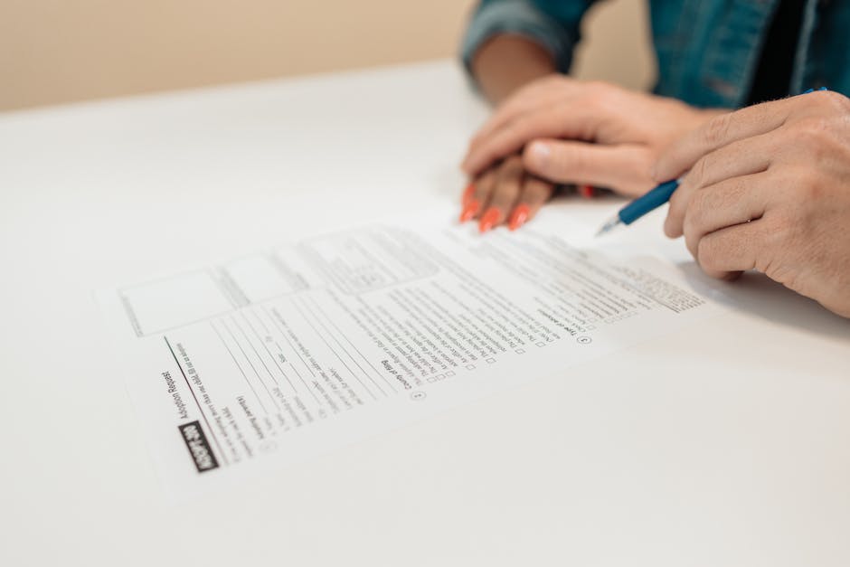 Vacation request email and legal documents on desk