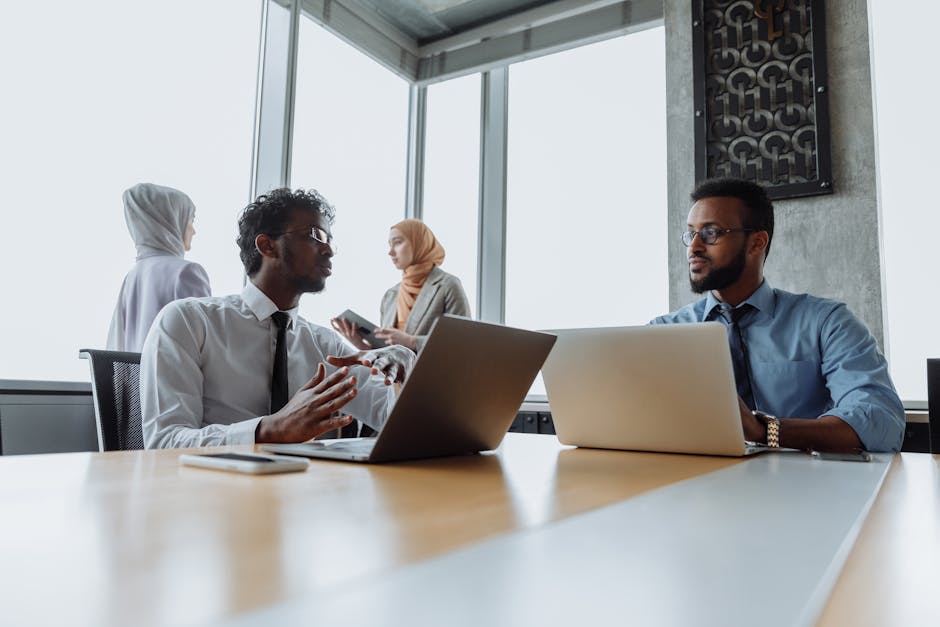 Colleagues discussing ideas in a modern workplace