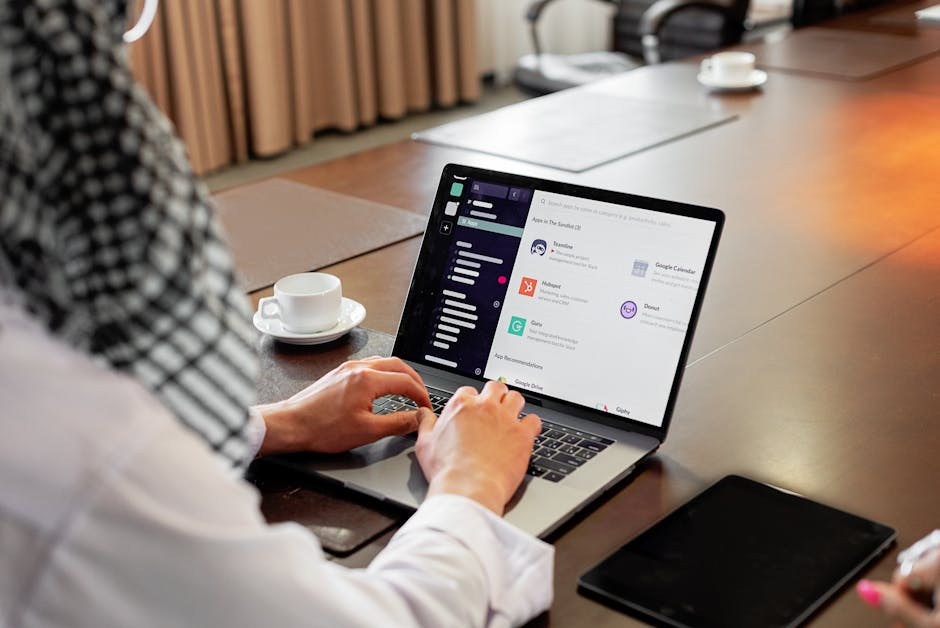Recruiter reviewing a job application email on a laptop