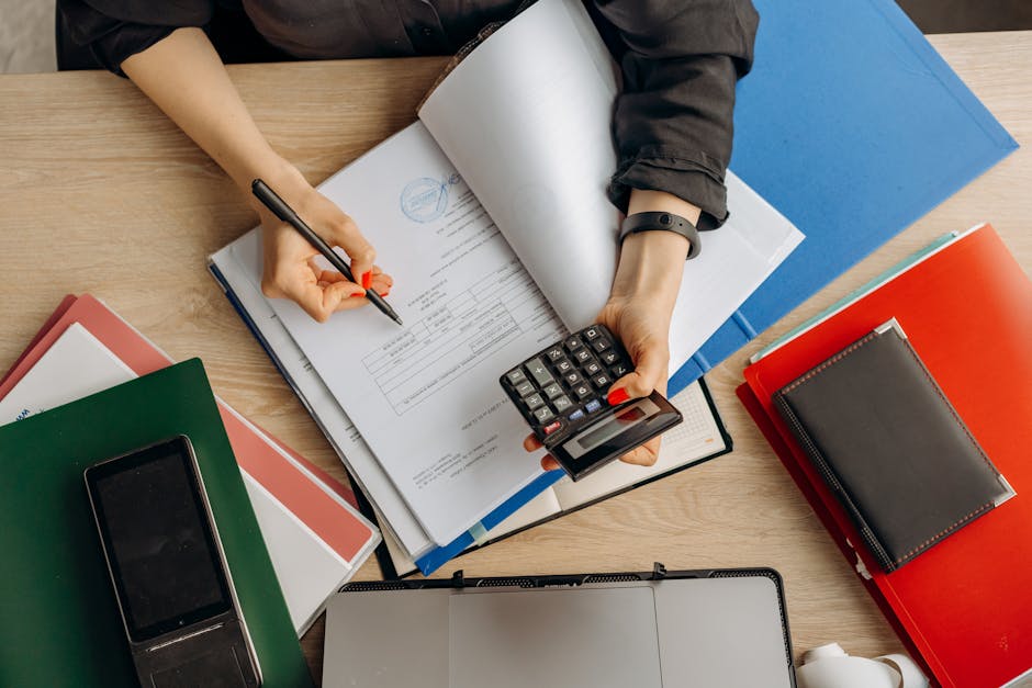 Close-up of a French payslip and calculator on a desk