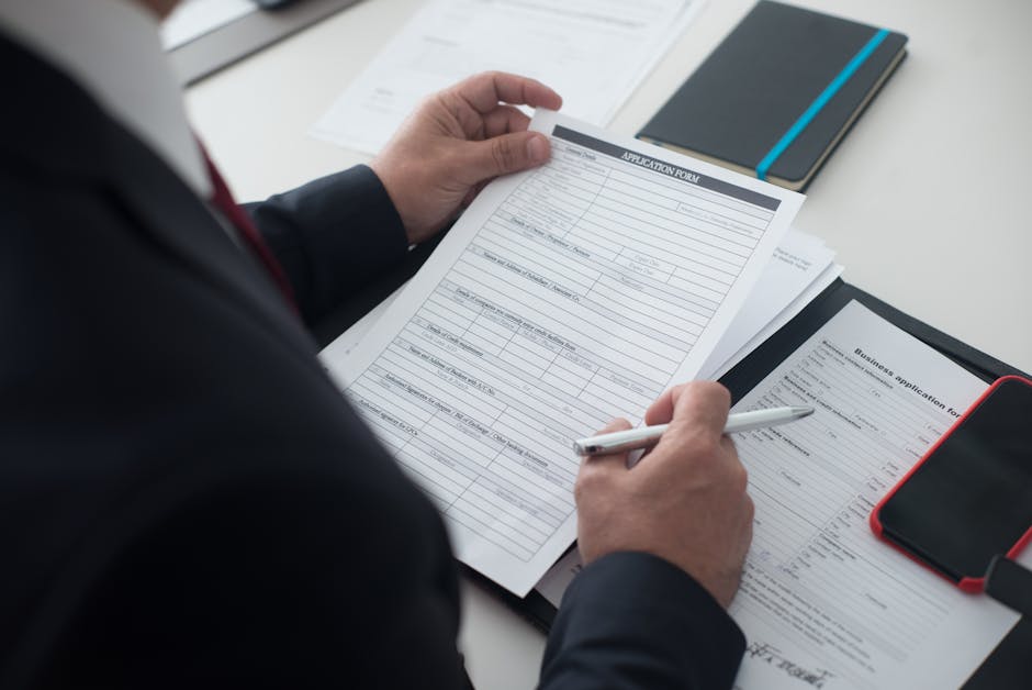 Professional recruiter reviewing a candidate letter and CV on a desk
