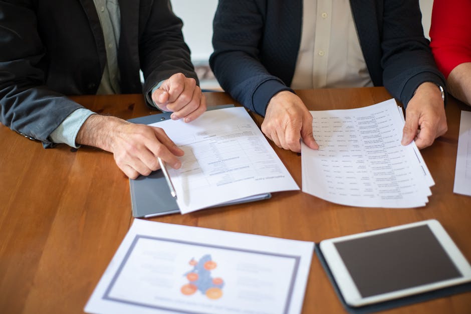 HR team reviewing employment contract and payroll rules