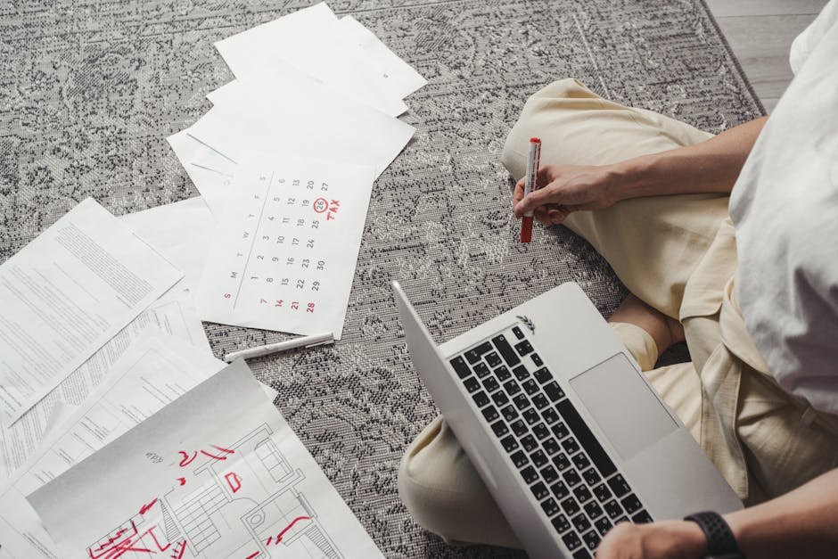 Business professional reviewing paperwork with a calendar and documents