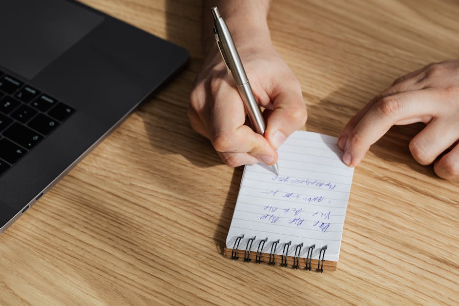 Person taking notes during employee onboarding session