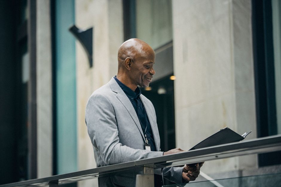 Business executive in a modern office overlooking a city skyline