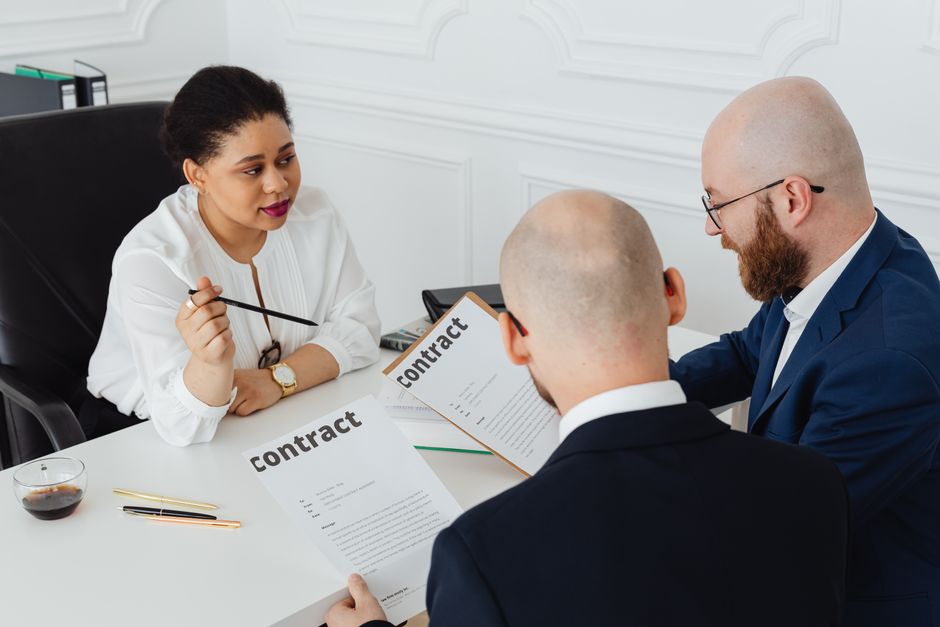 Business meeting discussing employment contract termination