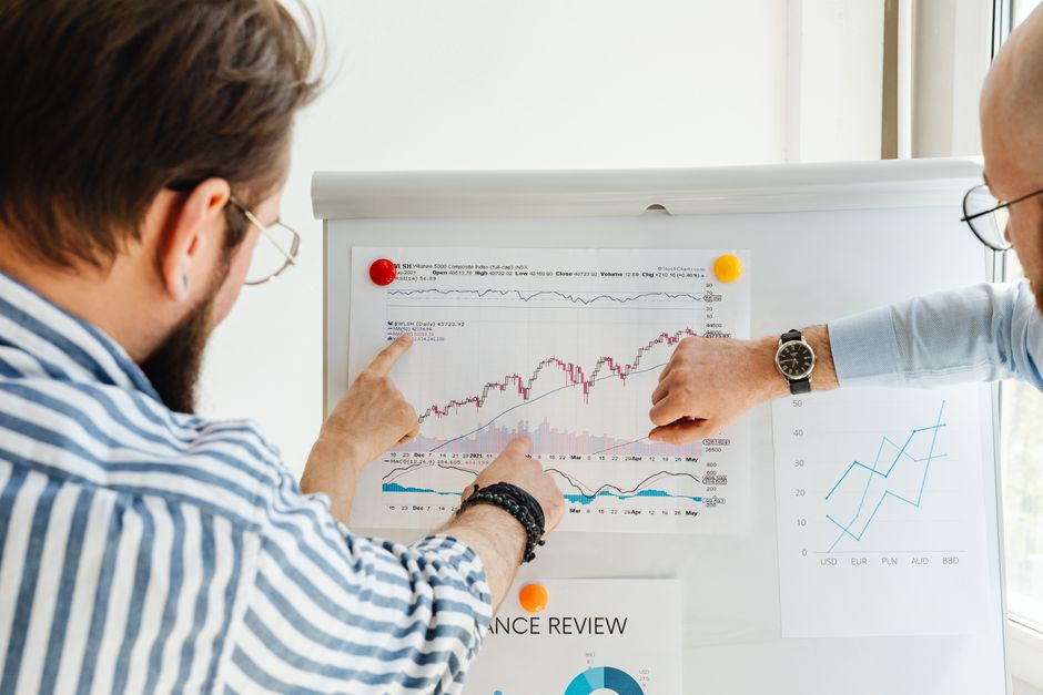 Business meeting analyzing performance charts and employee evaluation