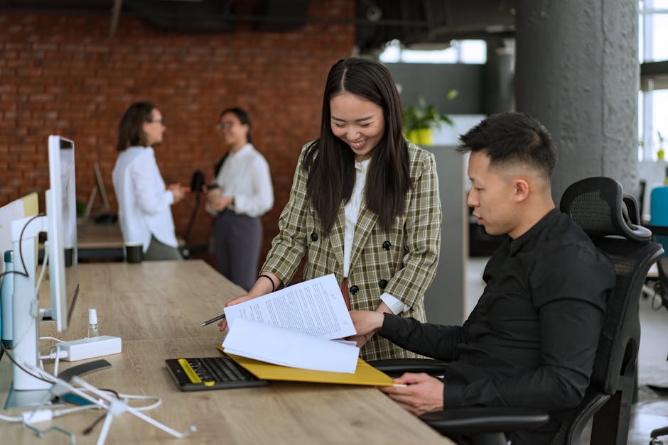 Team of coworkers collaborating in a modern office, illustrating belonging at work