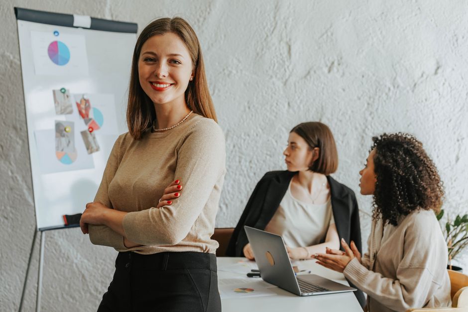 Confident manager leading a team in a corporate meeting room