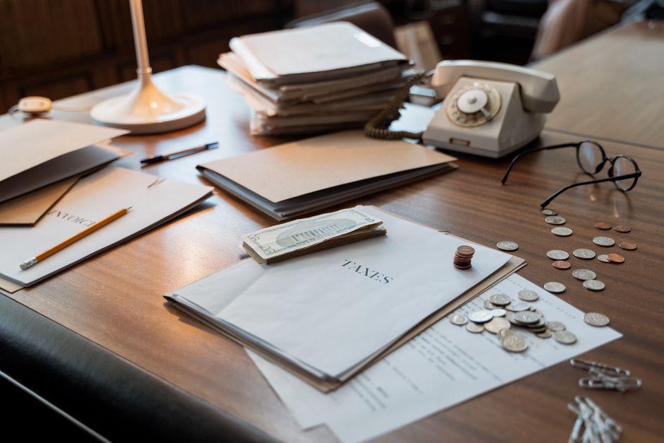 Business professional reviewing financial documents and tax calculations